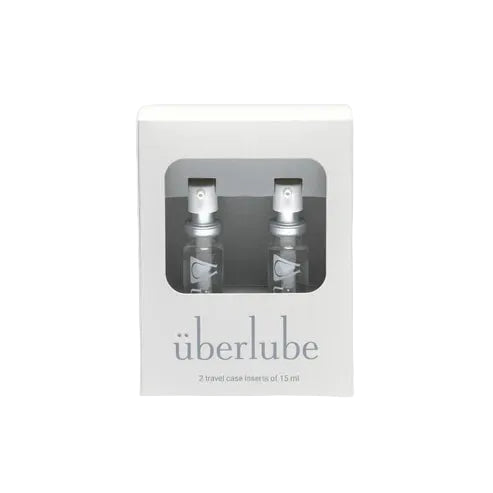 Two travel case inserts of überlube in a clear packaging box on a white background