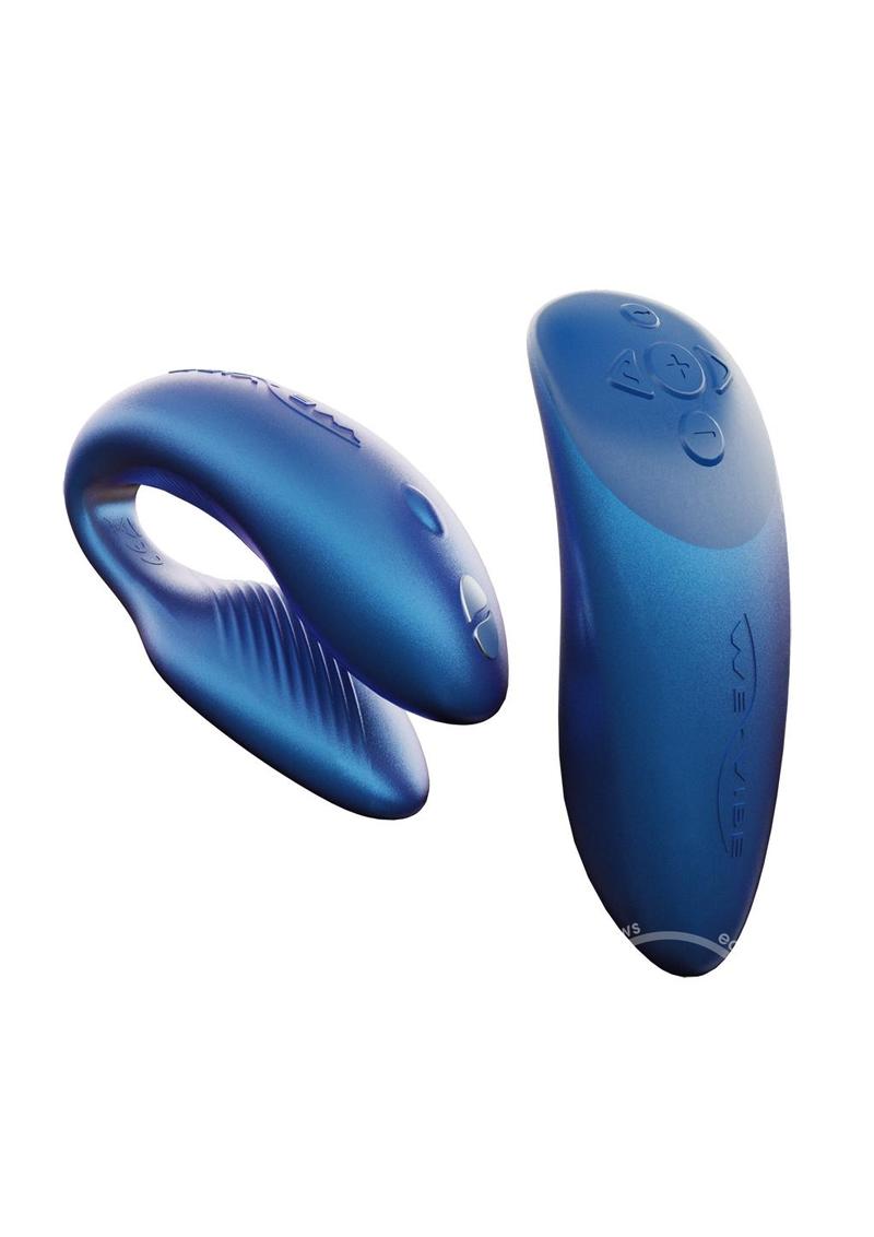 A blue couples vibrator with an interactive squeeze remote control. The vibrator has a clamshell c-shaped curved design, with parts that vibrate externally on the clit and internally on the g-spot. The remote is sleek, small enough to fit in the palm of your hand. The remote has buttons to increase and decrease intensity as well as change the pattern. This toy is deep blue in color.